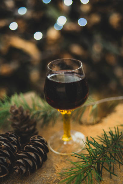 istock Glass of wine with Christmas lights 1074243342