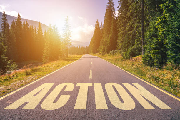 istock Action word written on road in the mountains 1074245438