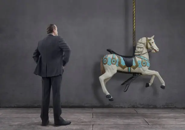 Photo of Businessman with Carousel Horse