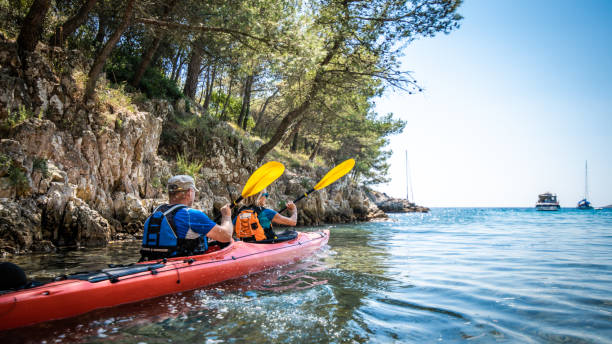 istock Mature man and woman kayaking 1074257562