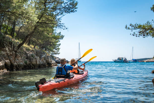 istock Mature man and woman kayaking 1074257582