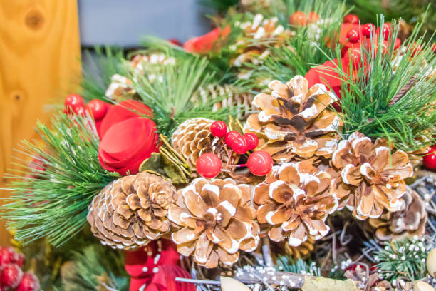 istock Christmas attributes pine cone and holly berries on the Christmas-tree branch. 1074257750