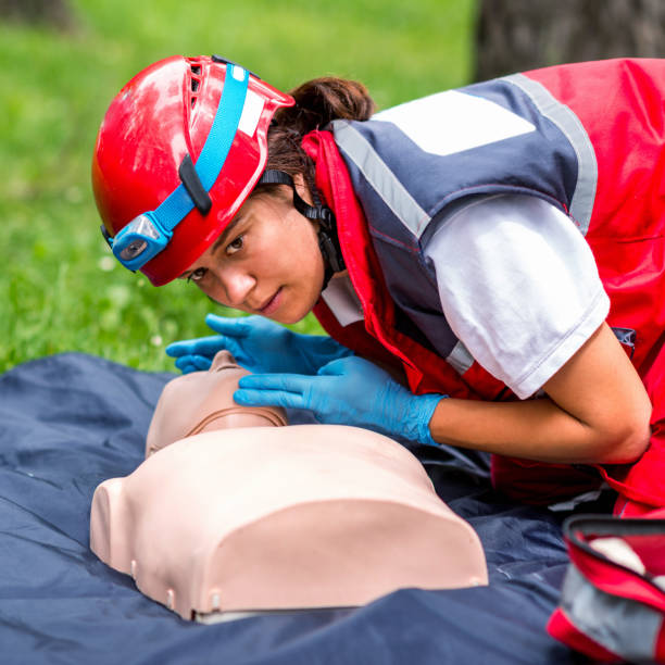 istock Healthcare Worker Practicing On Cpr Dummy At Park 1074258340