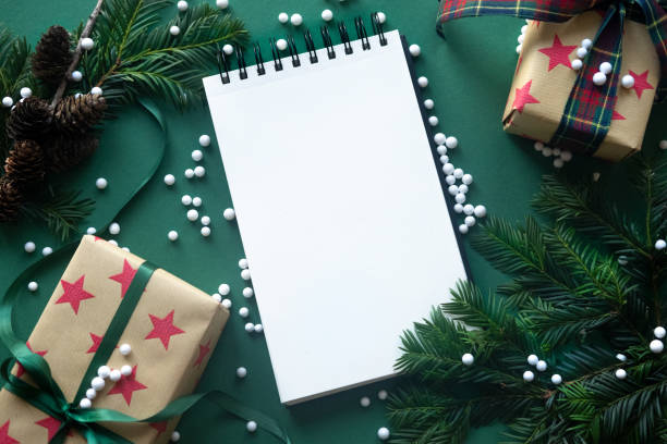 istock Christmas background. Snow Fir tree branch, present box and xmas decorations. Top view with copy space. 1074259192