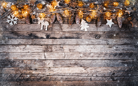 Decorative Christmas rustic background on wooden planks. Celebration and holiday concept. Free space for text.