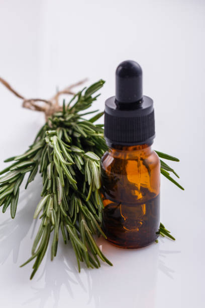 istock Rosemary essential oil on a white background 1074265520