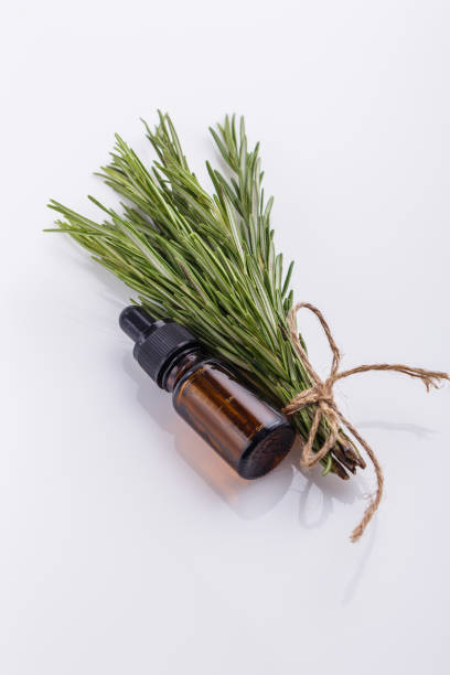 istock Rosemary essential oil on a white background 1074265560