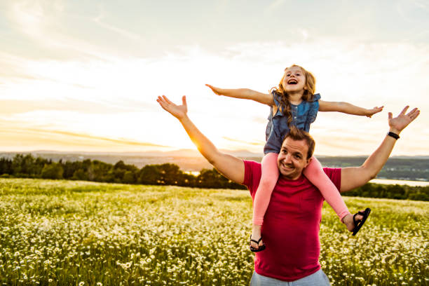 istock Father spending time with daughter during the sunset. 1074268420