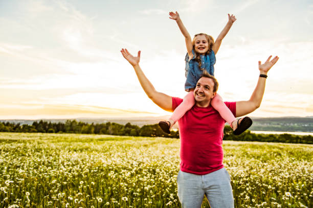 istock Father spending time with daughter during the sunset. 1074268460