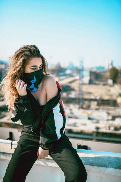 istock Female Hip Hop Dancer Leaning On a Rooftop Fence 1074270446