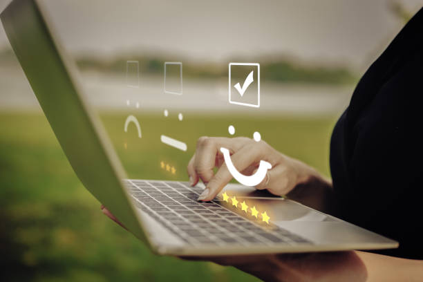 Customer service evaluation concept. Businesswoman pressing face emoticon on the keyboard laptop / Customer service evaluation concept. product review stock pictures, royalty-free photos & images