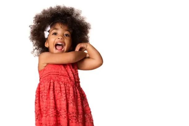 Photo of Portrait of cheerful african american little girl, isolated with copyspace