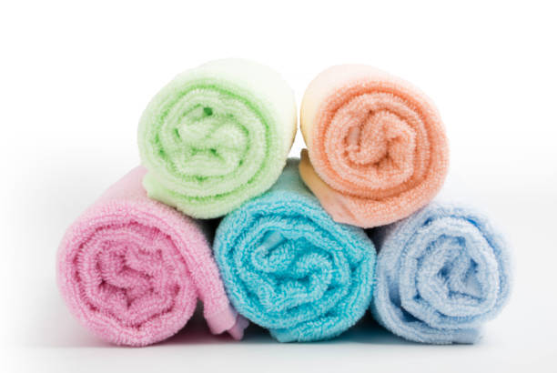 istock pile of rainbow colored towels isolated white background 1074273438