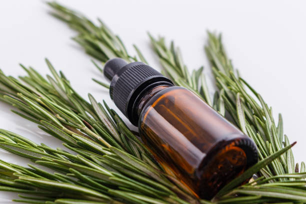 istock Rosemary essential oil on a white background 1074273876