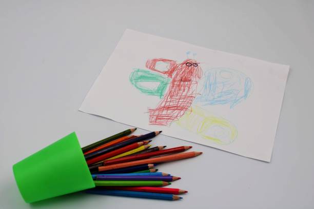 istock Colored pencils and funny drawing 1074274278