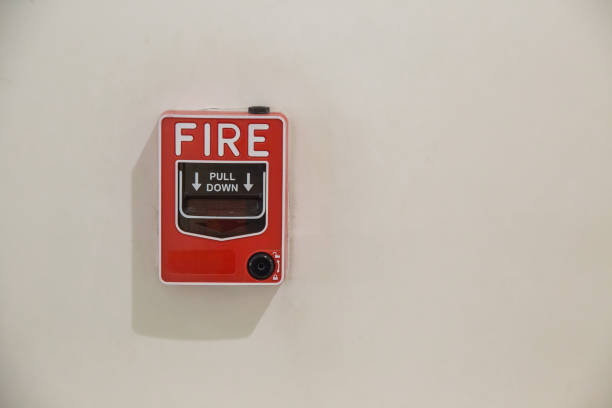 istock fire alarm box on cement wall for warning and security system in the condominium place. standard safety in the resident 1074276750