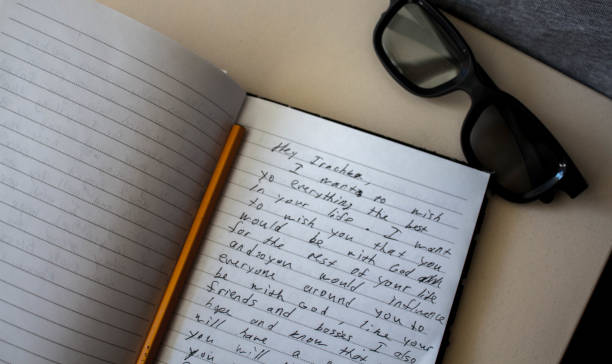 istock a notebook glasses and a pencil on the table 1074278472