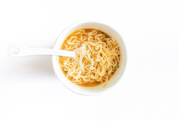 istock noodle soup in a cup view from top on white background 1074280334