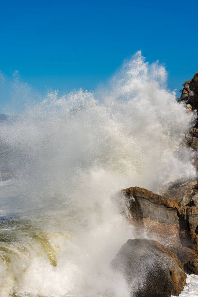 istock Waves Breaking on the Cliff - Liguria Italy 1074280822