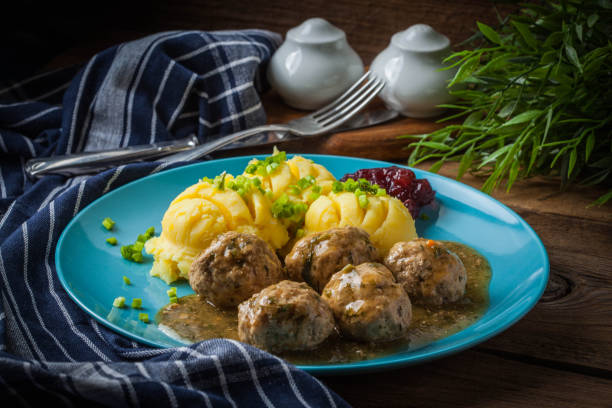 istock Meatballs with potatoes in dill sauce. 1074282012