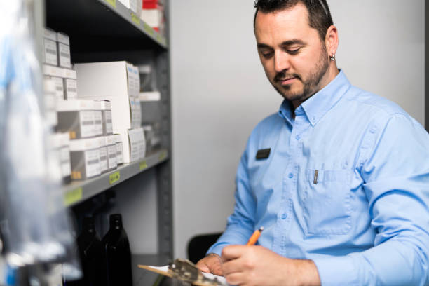 istock merchandiser checking products availibility for car repair 1074282622
