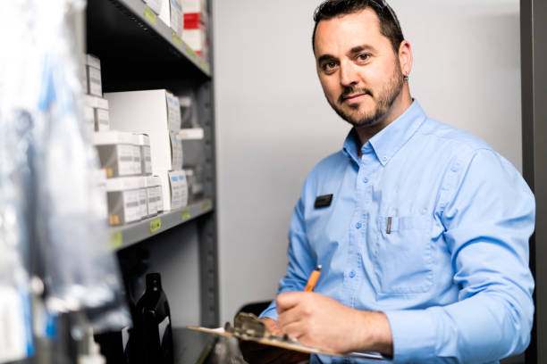 istock merchandiser checking products availibility for car repair 1074282698