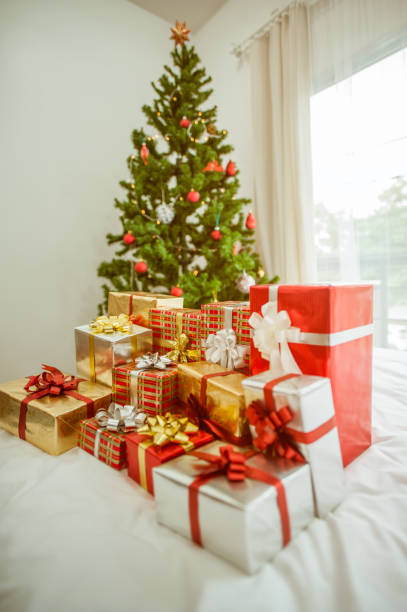 istock Stacks of Christmas presents under a Christmas tree. 1074285964