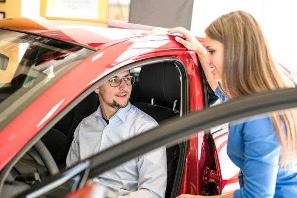 istock Business car seller working with the client 1074286488