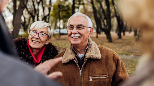 istock Smiling couple with friends 1074286592