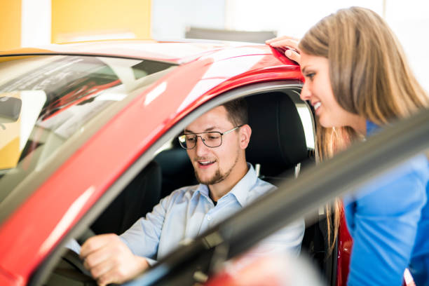istock Business car seller working with the client 1074286598