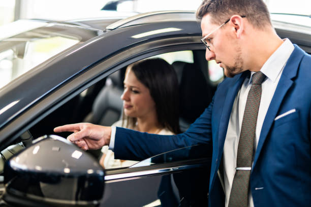 istock Business car seller working with the client 1074286648