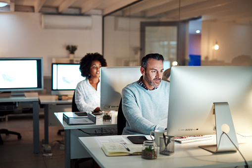 Working On Their Individual Tasks Stock Photo - Download Image Now ...