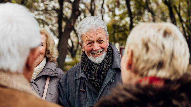 istock Smiling man meeting his friends 1074287056
