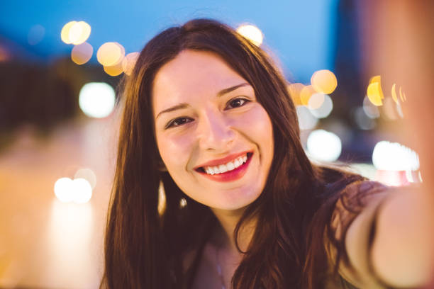 istock Beautiful woman taking selfie at Christmas 1074288466