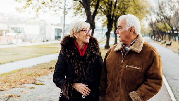 istock Smiling couple looking at each other 1074288820
