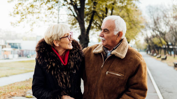 istock Old people walking at the park 1074288852