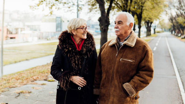 istock Smiling couple in the park 1074288858