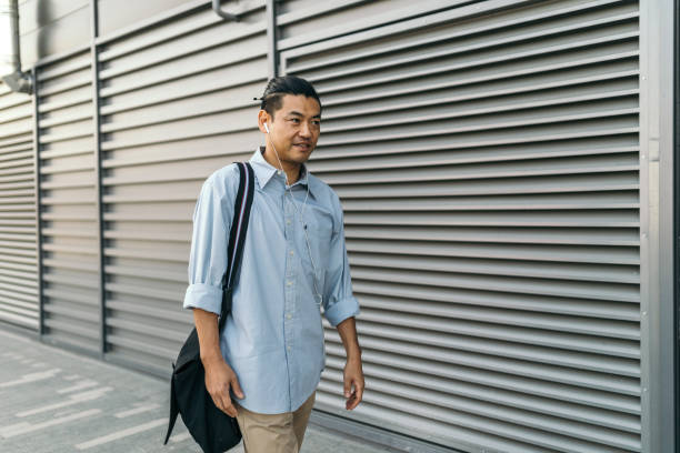 istock Mid adult Japanese walking to work 1074289388
