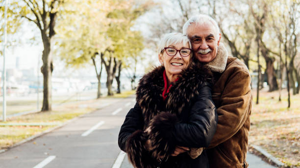 istock Happy mature couple hugging 1074290042