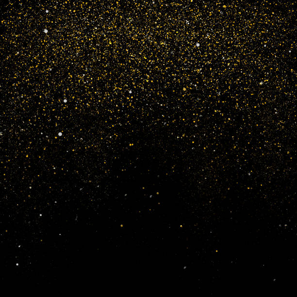 Gold glitter over black background