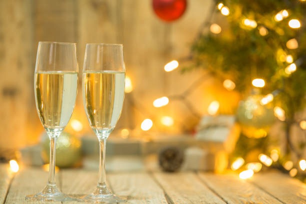 istock Wine glasses in front of a Christmas tree 1074292594