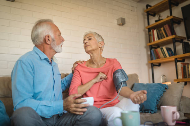 istock Senior couple doing a blood pressure test at home 1074294576