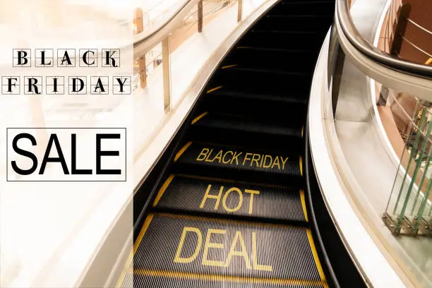 Photo of Black Friday Sale, escalator in Shopping mall moving motion with world Black Friday Hot deal