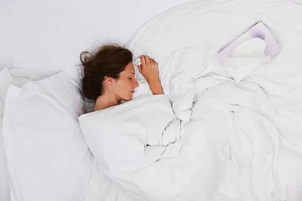 Photo of Sick woman sleeping in bed