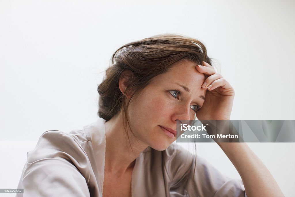 Depressed woman with head in hands  Women Stock Photo