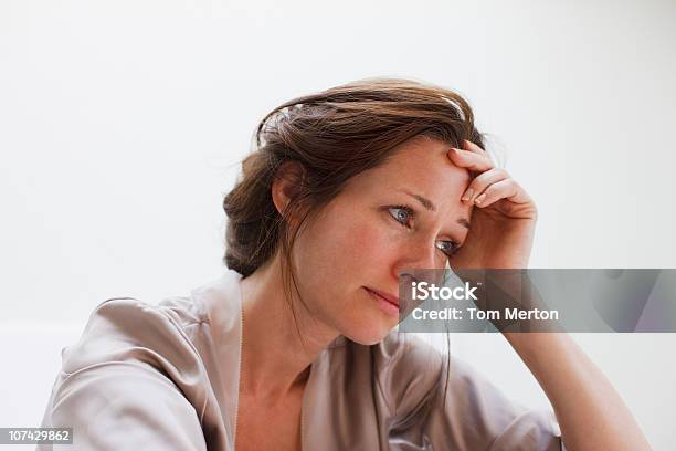 Depressed Woman With Head In Hands Stock Photo - Download Image Now - Women, One Woman Only, Sadness