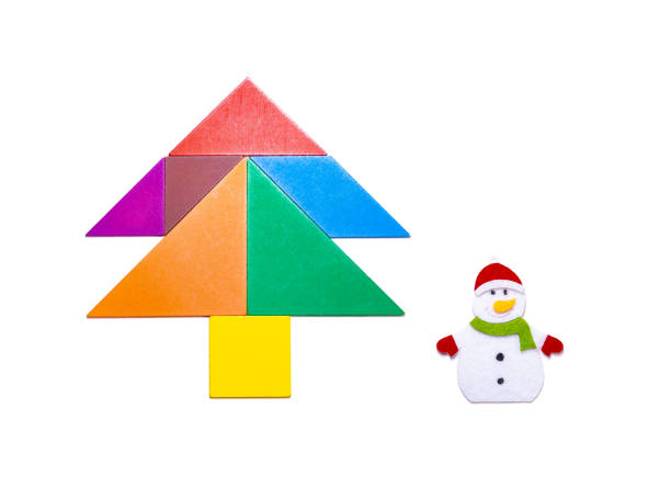 istock tangram blocks shape as Christmas tree with snowman on white 1074301088