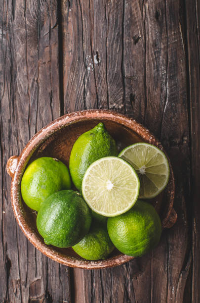 istock Fresh lime on wood board, bio fruit 1074302176