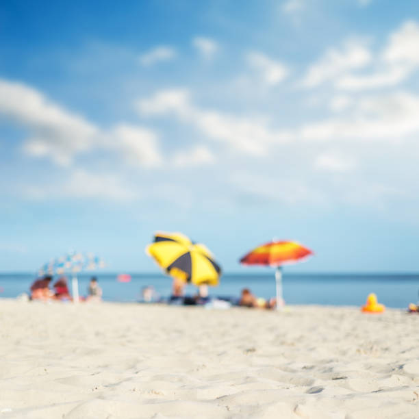 istock sea, sand and umbrellas under hot sun 1074312228
