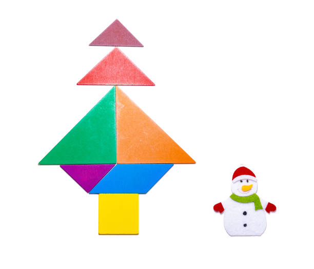 istock tangram blocks shape as Christmas tree with snowman on white 1074322308